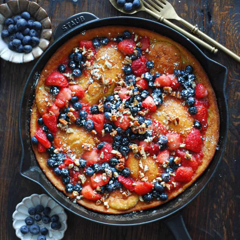 Dutch Baby Pancake with Cooked Strawberries, Blueberries, and Pecans