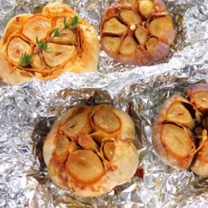 oven roasted garlic bulb wrapped in aluminum foil