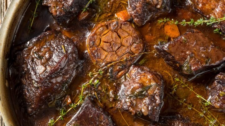 red wine braised short ribs served in a metal pan