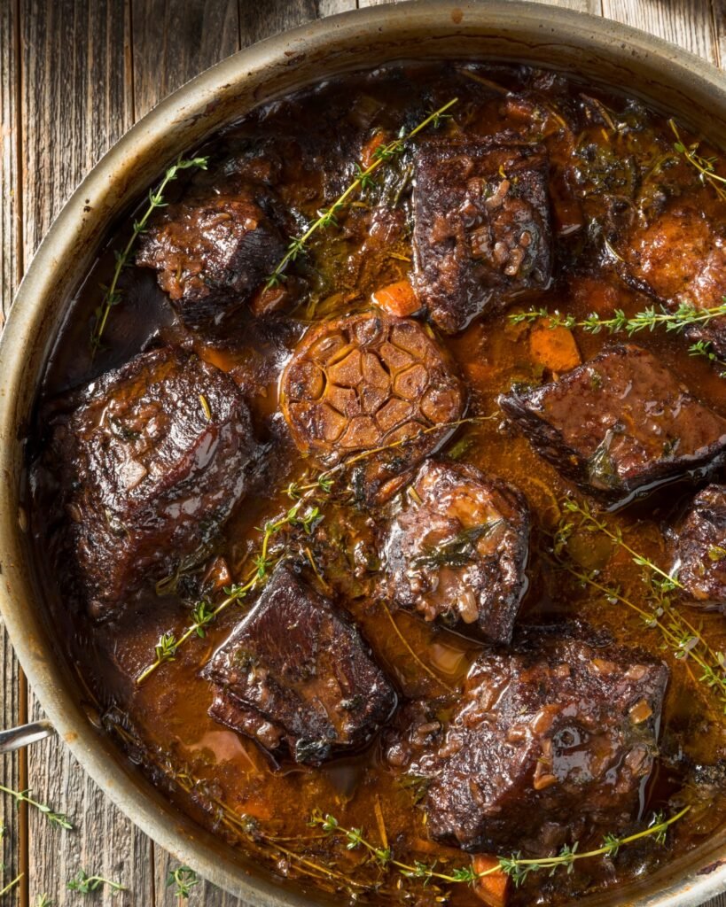 red wine braised short ribs served in a metal pan