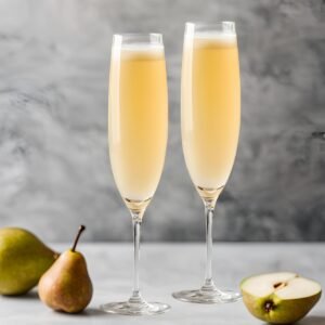 pear bellini cocktail in a champagne glass