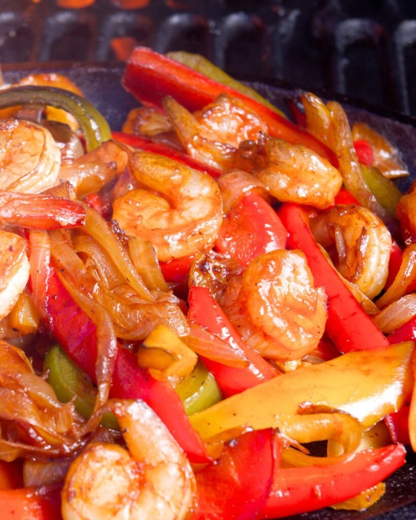 close up of shrimp fajitas with mixed bell peppers